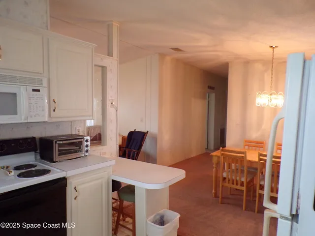 a very nice looking dining room with a table and chairs