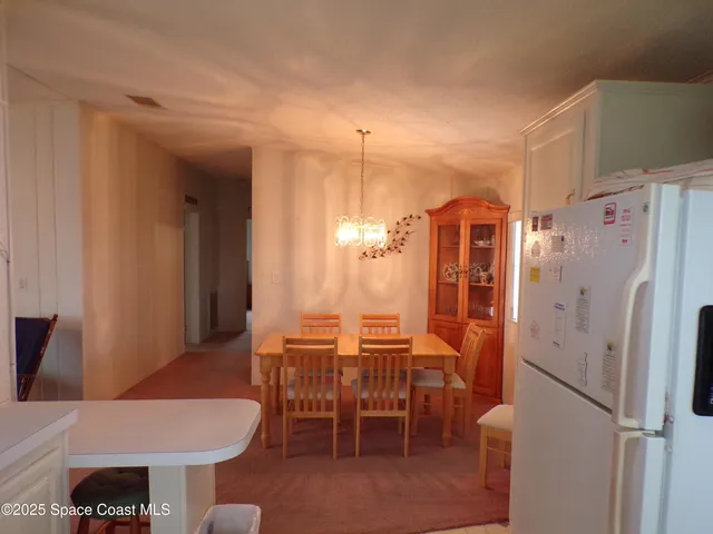 a dining room with a table and chairs