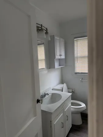 a bathroom with a sink toilet and tub