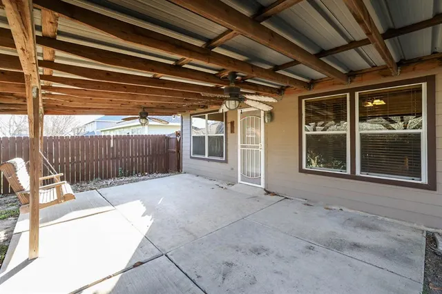 a view of porch with a black and white chair