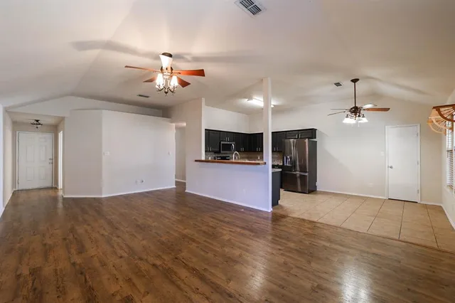 a view of a kitchen with a sink and a kitchen view