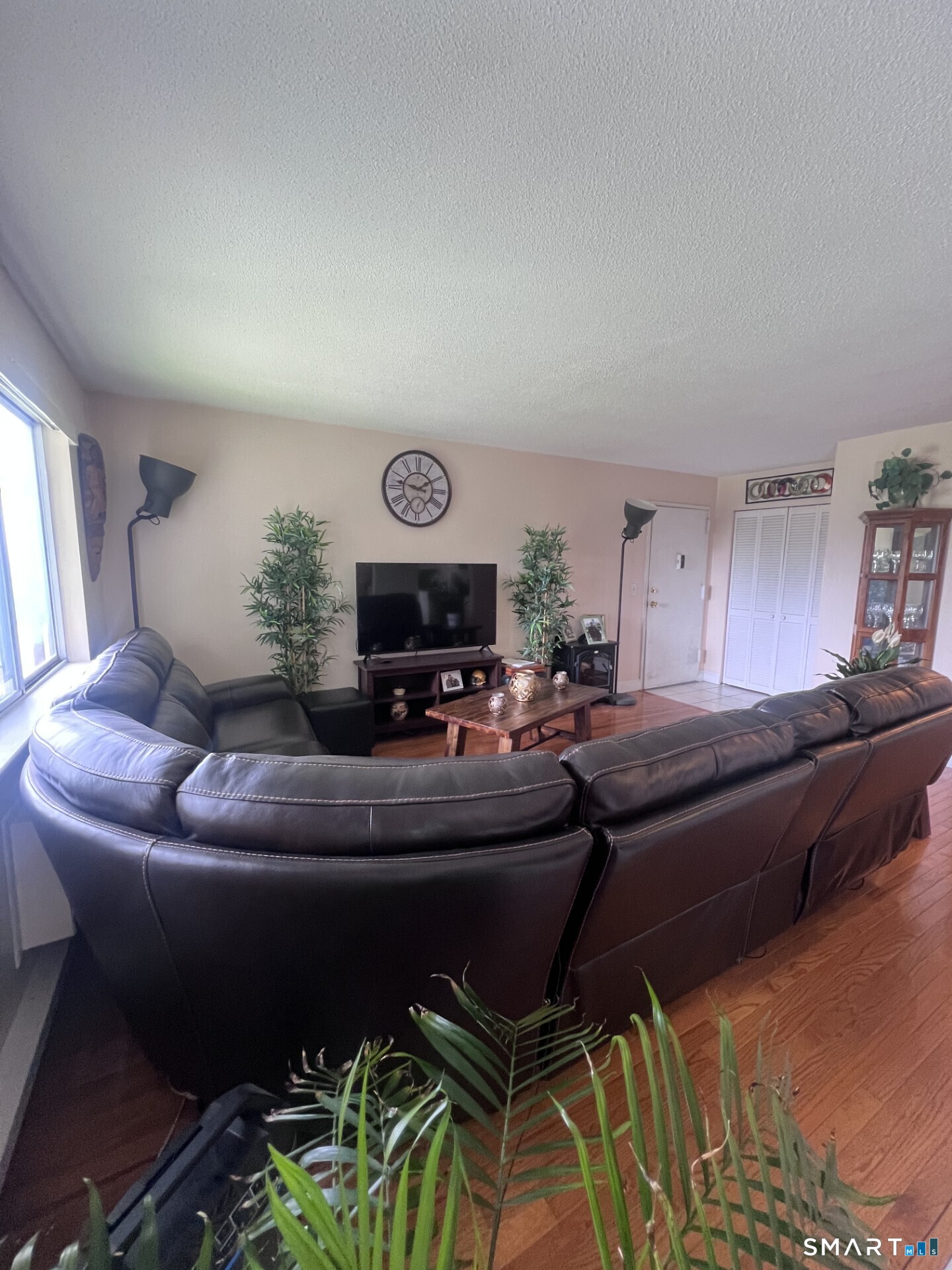 93 Kent Court, Unit 93 Meriden, CT 06450 - Photo 21 of 27 a living room with furniture and a flat screen tv