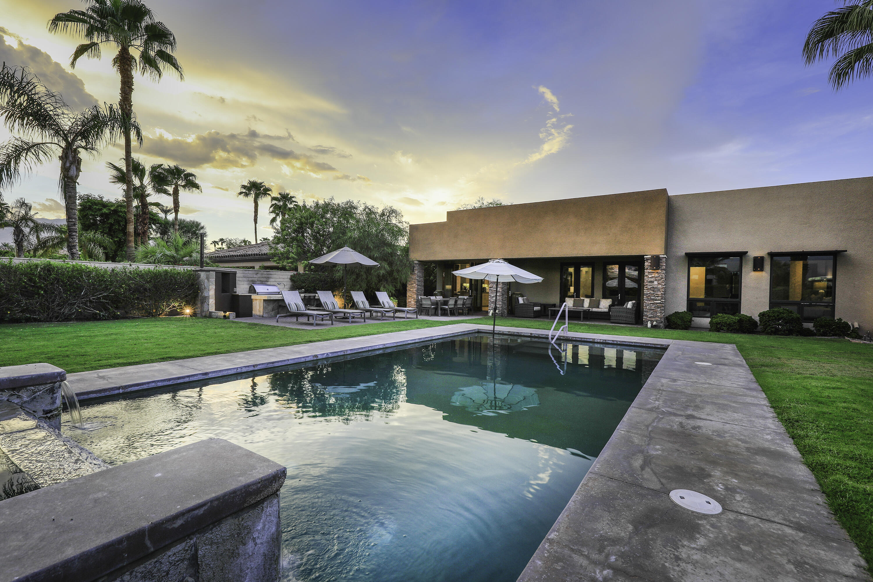 72737 Verbenia Road Rancho Mirage, CA 92270 - Photo 13 of 29 a view of house with garden and a fountain