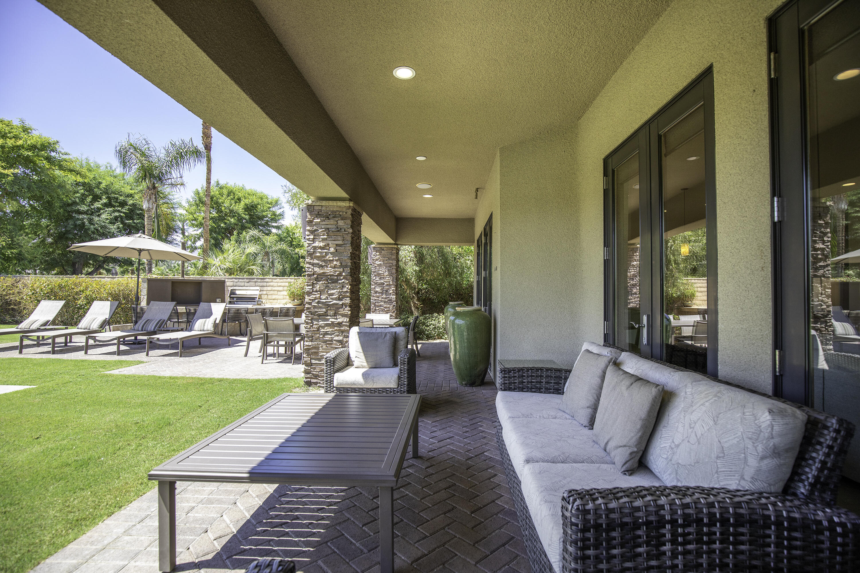 72737 Verbenia Road Rancho Mirage, CA 92270 - Photo 14 of 29 a living room with furniture and a large pool