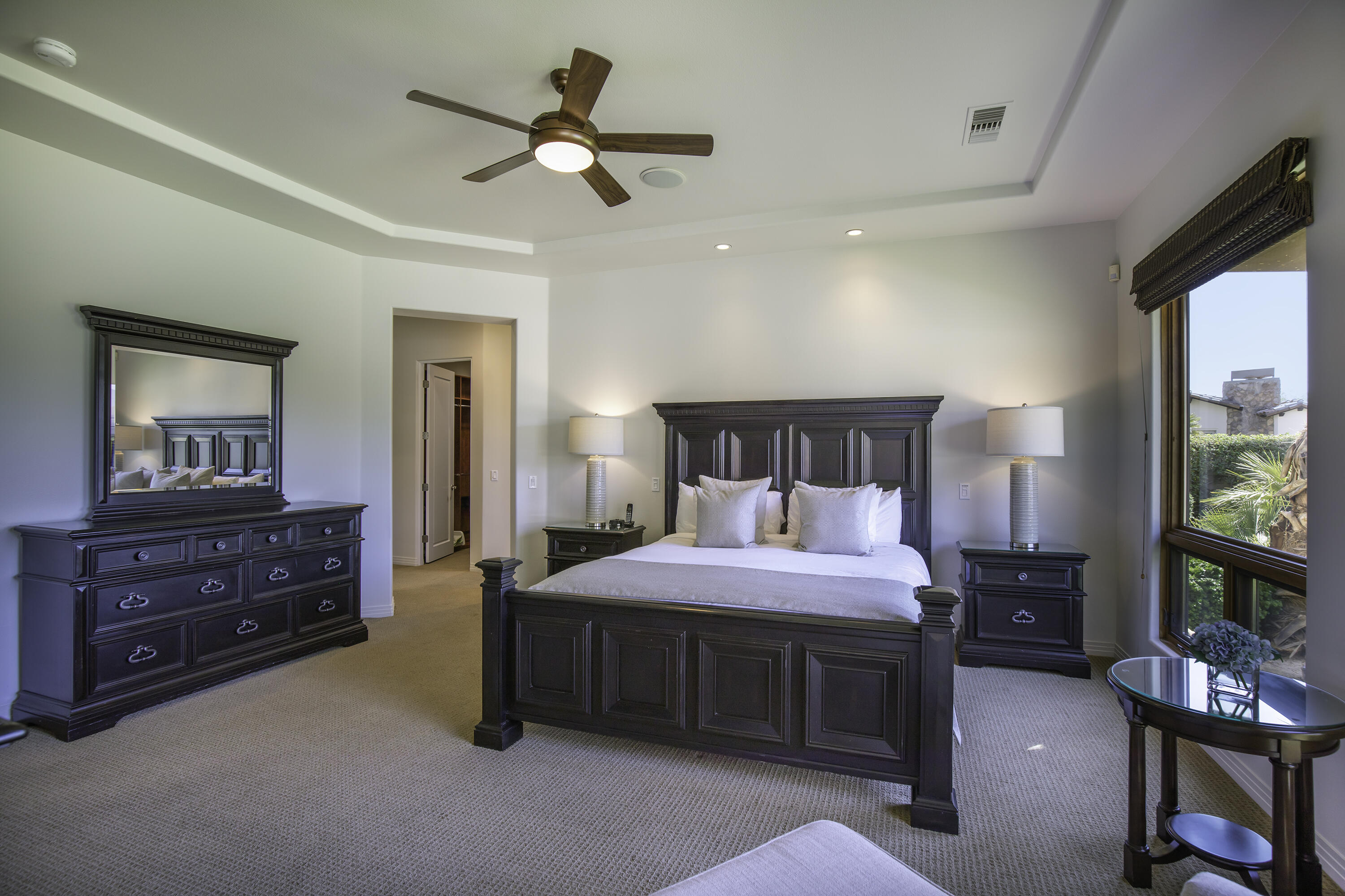 72737 Verbenia Road Rancho Mirage, CA 92270 - Photo 17 of 29 a bedroom with a bed and a flat tv screen on a dresser