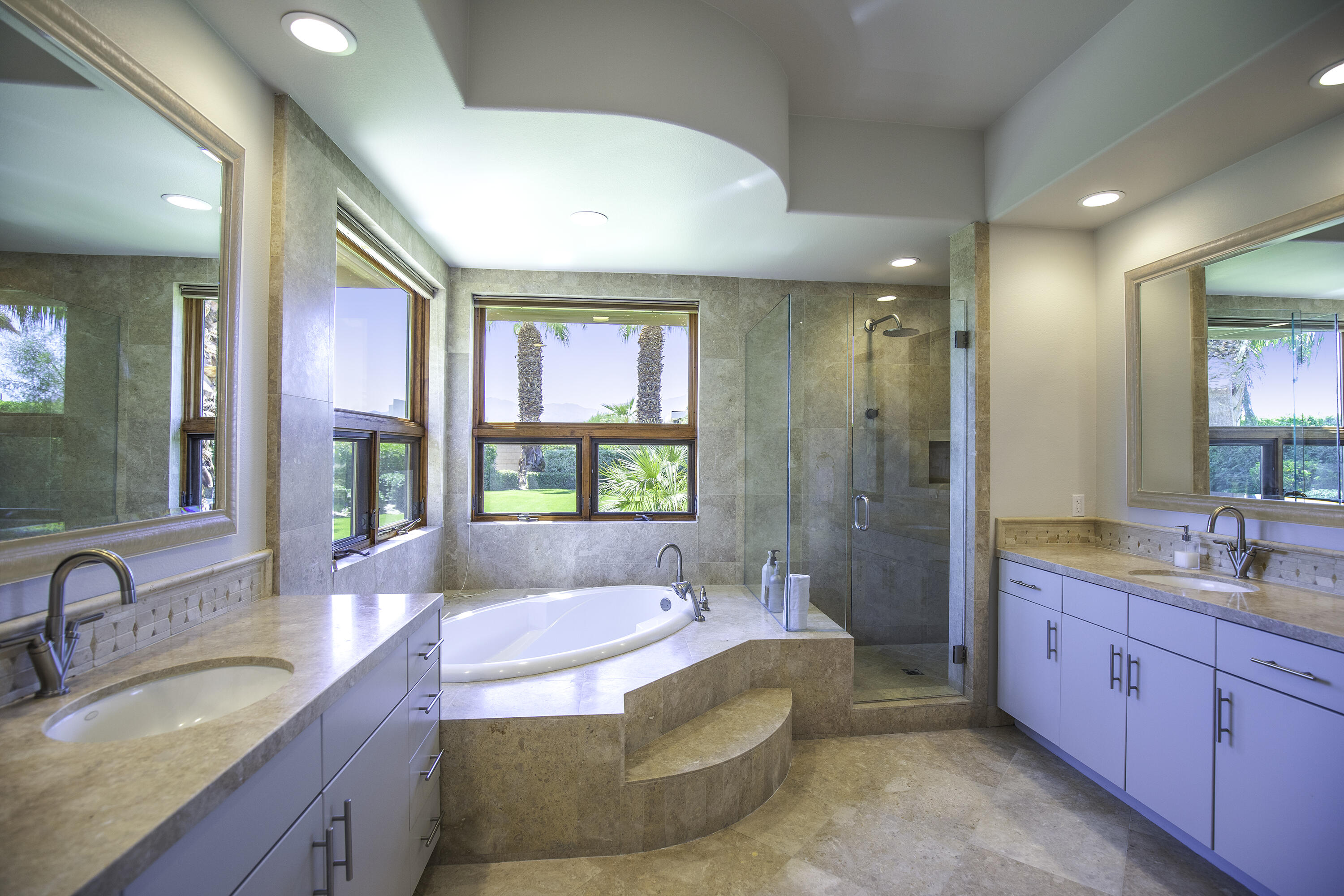 72737 Verbenia Road Rancho Mirage, CA 92270 - Photo 18 of 29 a spacious bathroom with a granite countertop tub sink and mirror