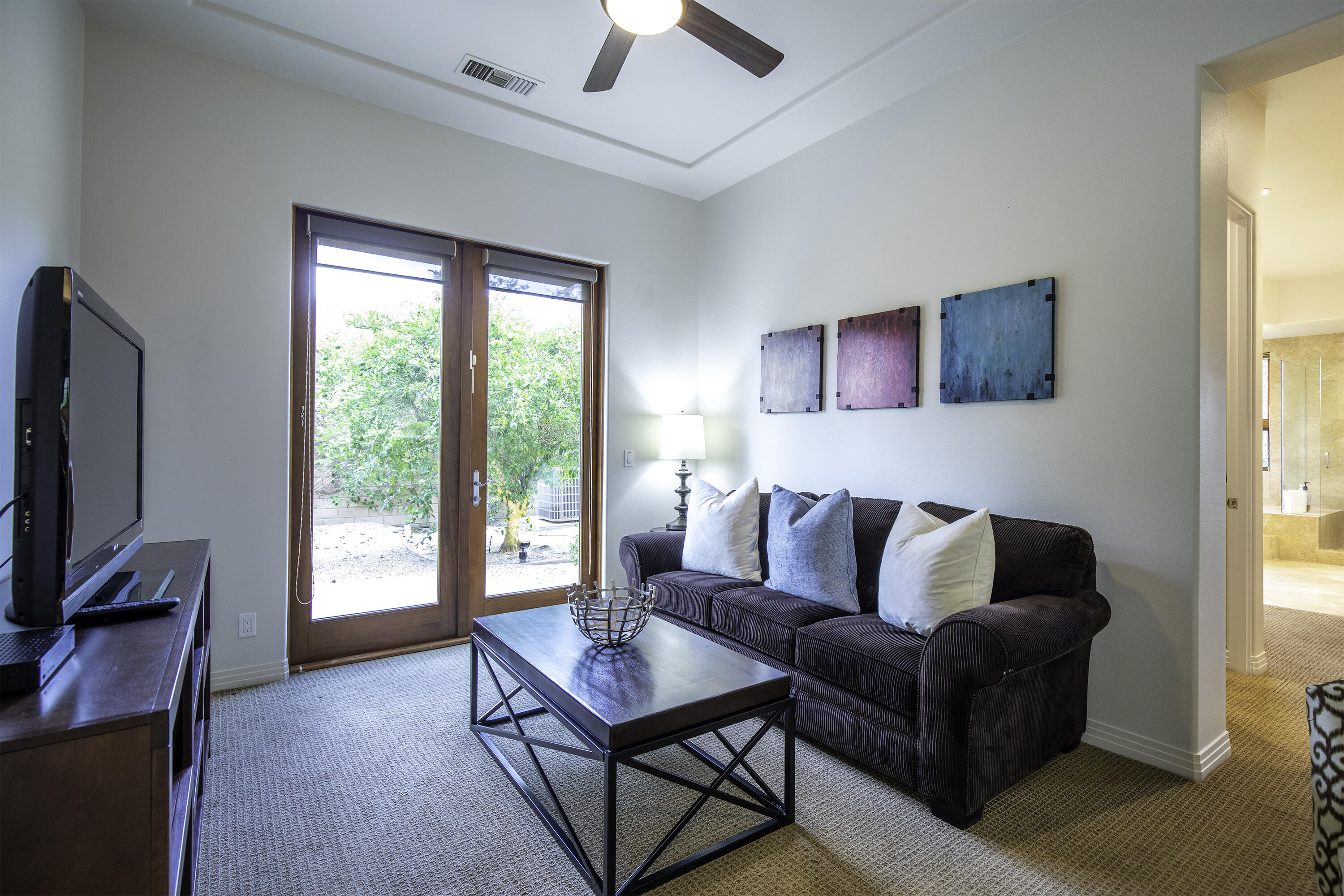 72737 Verbenia Road Rancho Mirage, CA 92270 - Photo 21 of 29 a living room with furniture and a flat screen tv