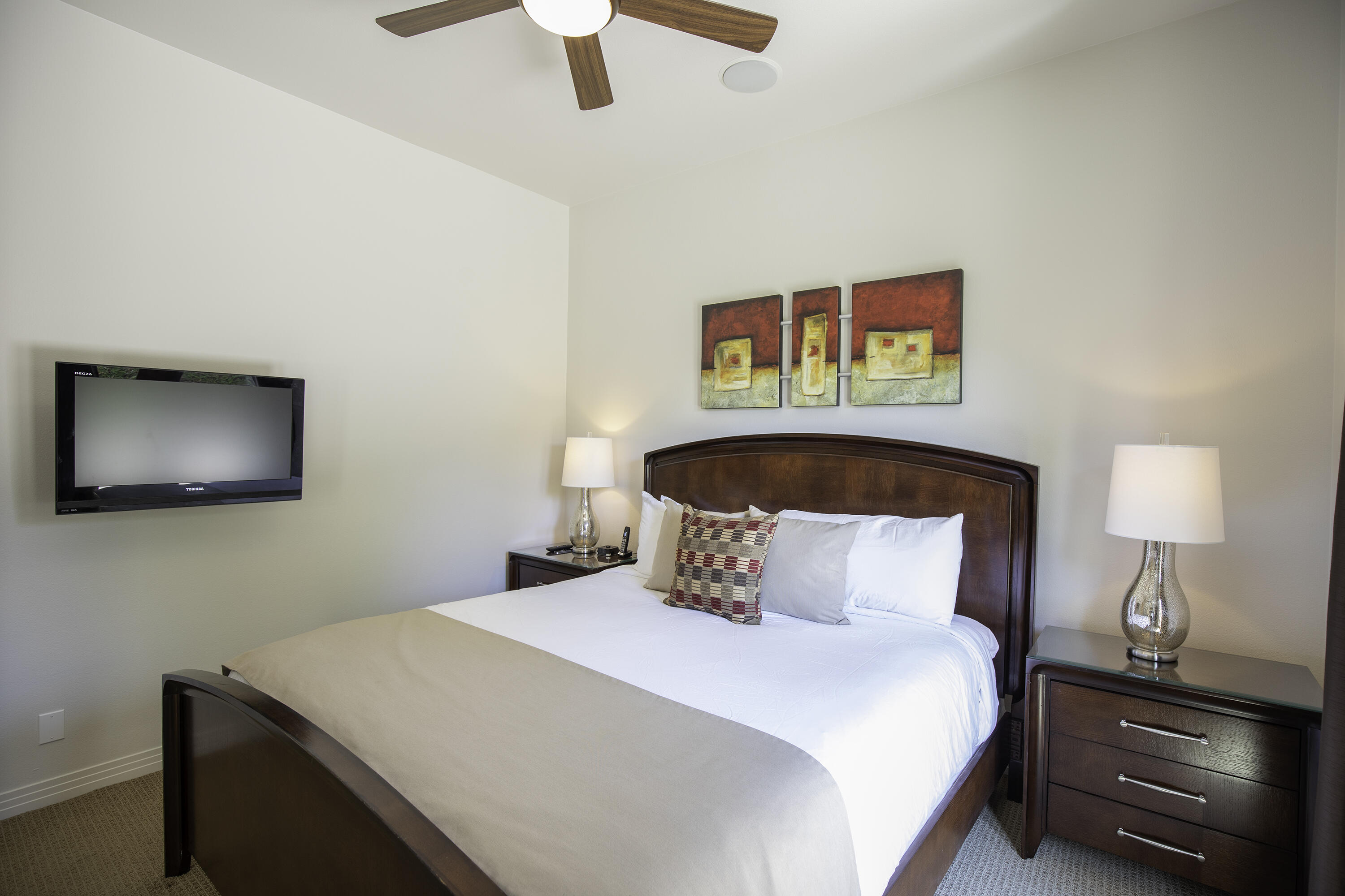 72737 Verbenia Road Rancho Mirage, CA 92270 - Photo 22 of 29 a bedroom with a bed and a lamp on dresser