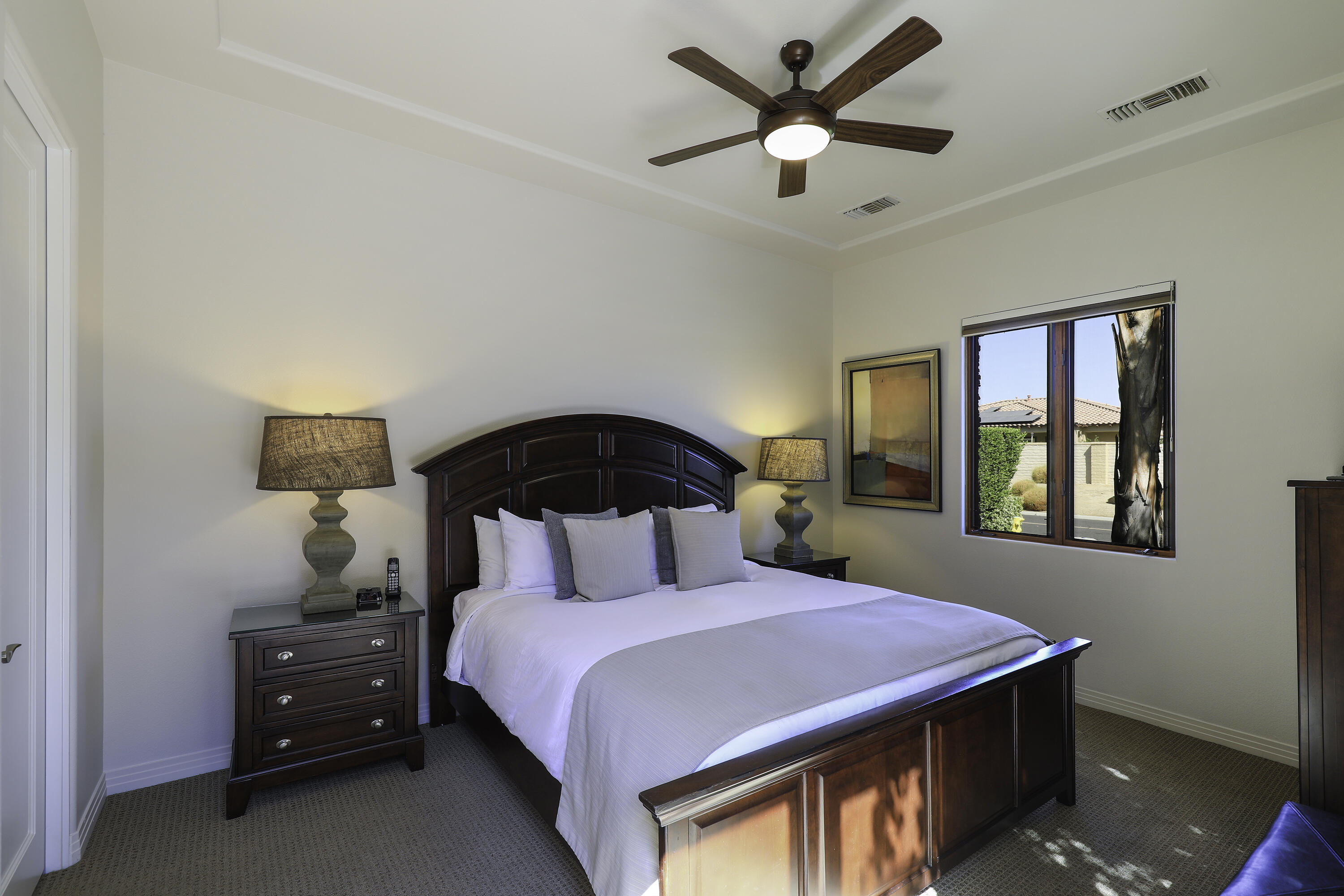 72737 Verbenia Road Rancho Mirage, CA 92270 - Photo 24 of 29 a bedroom with a bed and a window