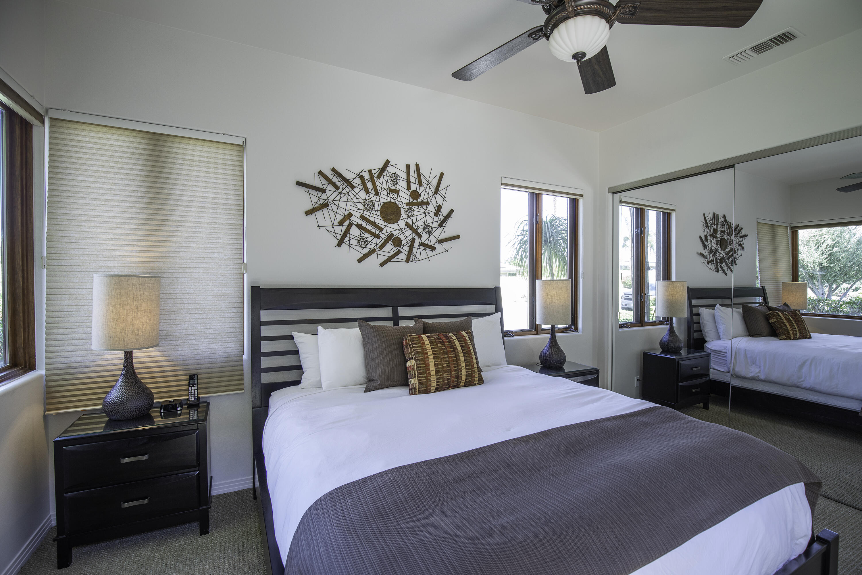 72737 Verbenia Road Rancho Mirage, CA 92270 - Photo 25 of 29 a bedroom with a bed and wooden floor