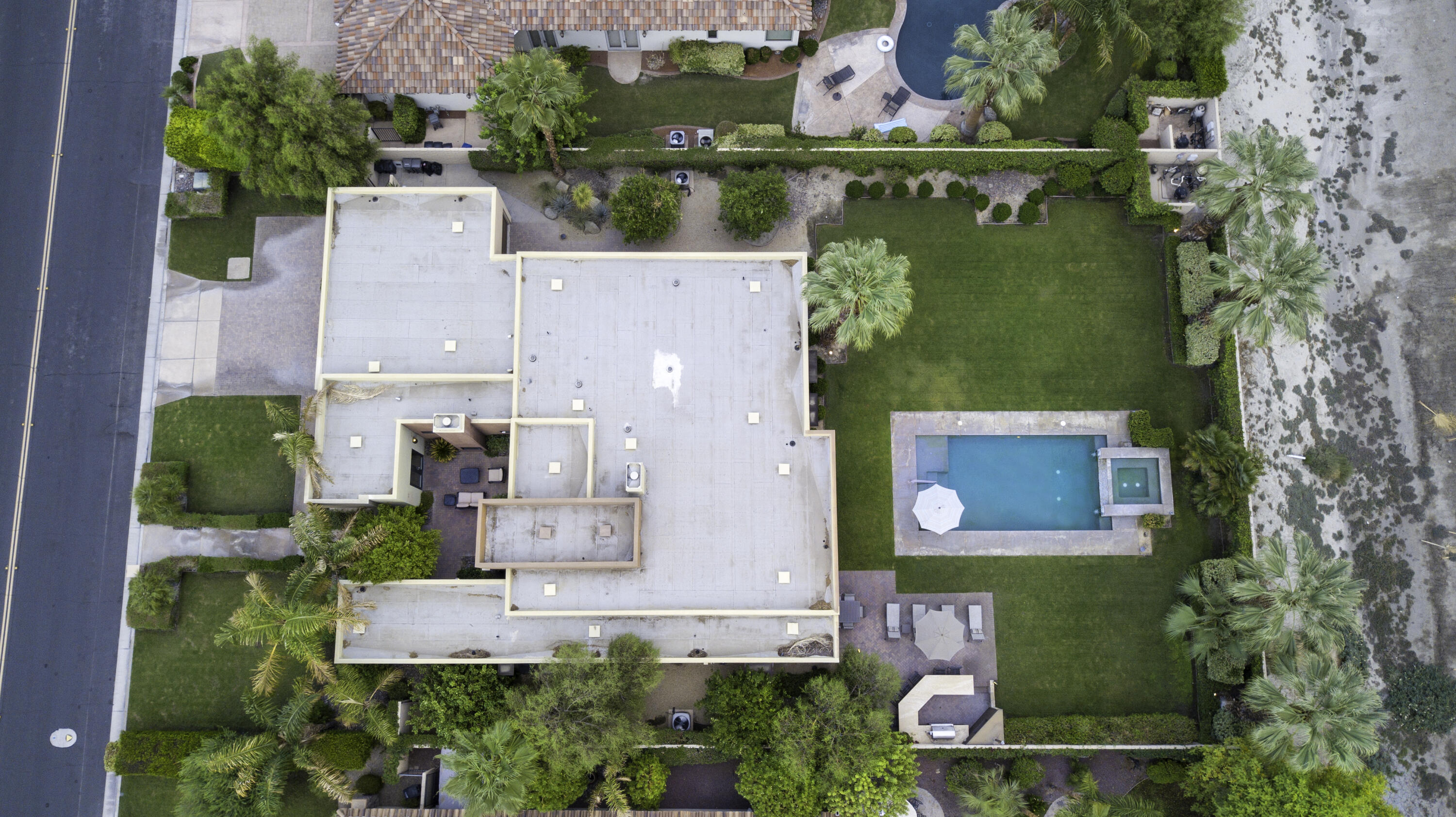 72737 Verbenia Road Rancho Mirage, CA 92270 - Photo 28 of 29 an aerial view of a house with a garden and yard