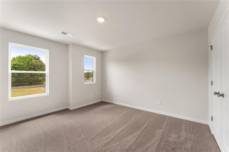 1303 Farmers Loop Austell, GA 30106 - Photo 19 of 21 an empty room with windows