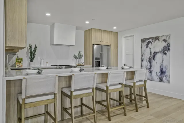 a kitchen with a sink cabinets and window