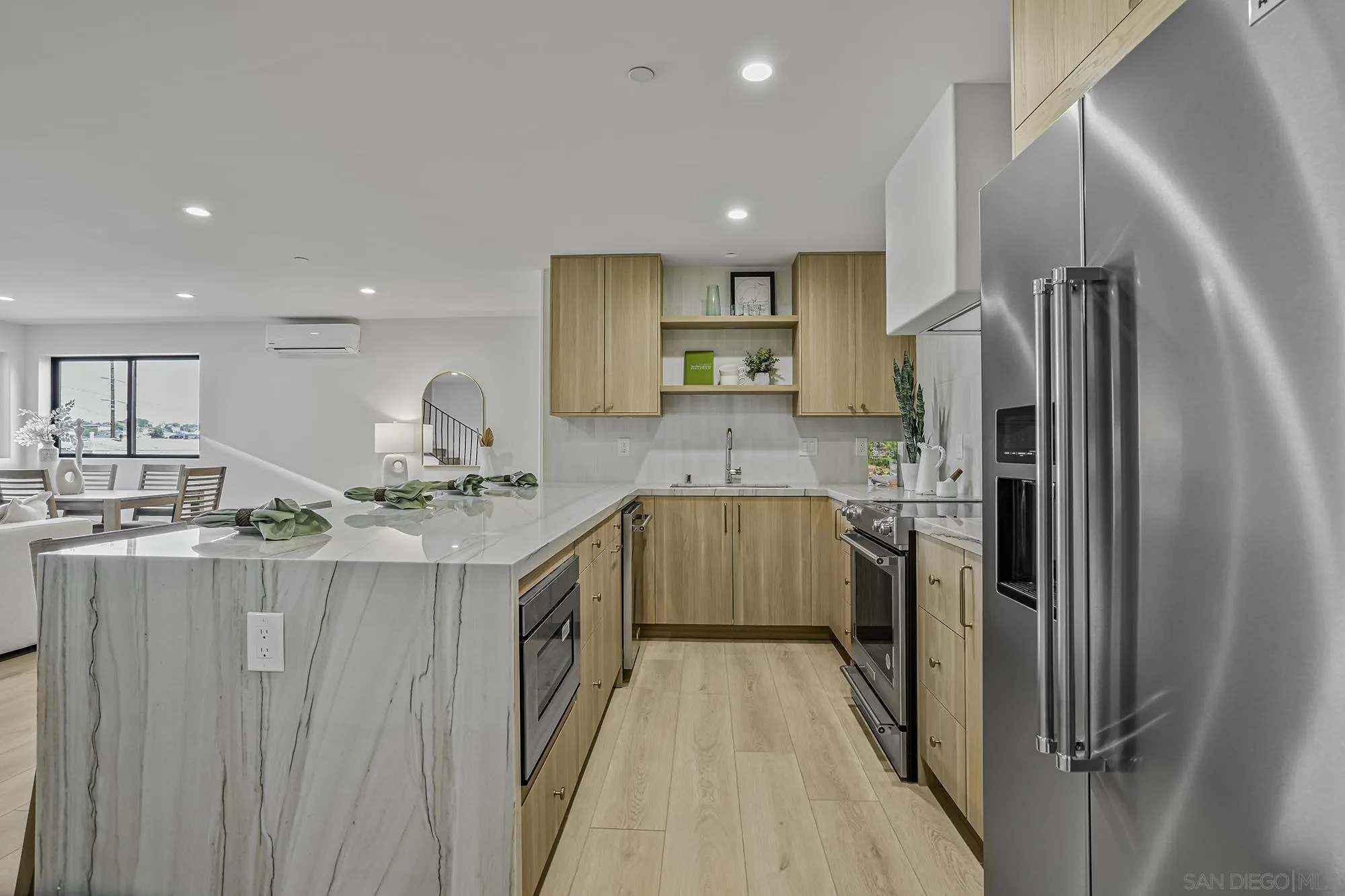 2126 San Clemente Street San Diego, CA 92107 - Photo 8 of 20 a kitchen with stainless steel appliances granite countertop a sink stove and refrigerator