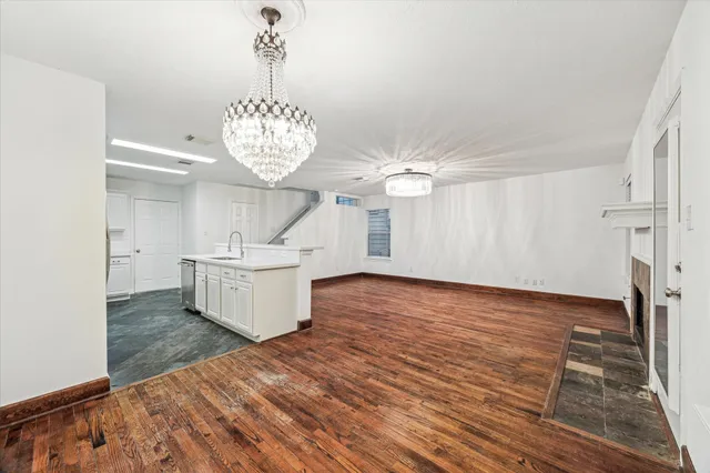 a kitchen with a sink and a refrigerator