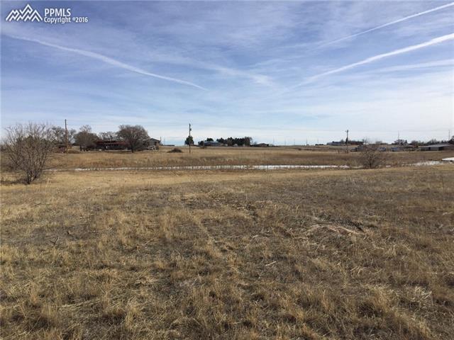 5965 Meridian Road Peyton, CO 80831 - Photo 15 of 15 Pond extends from the north fence line to the south fence line
