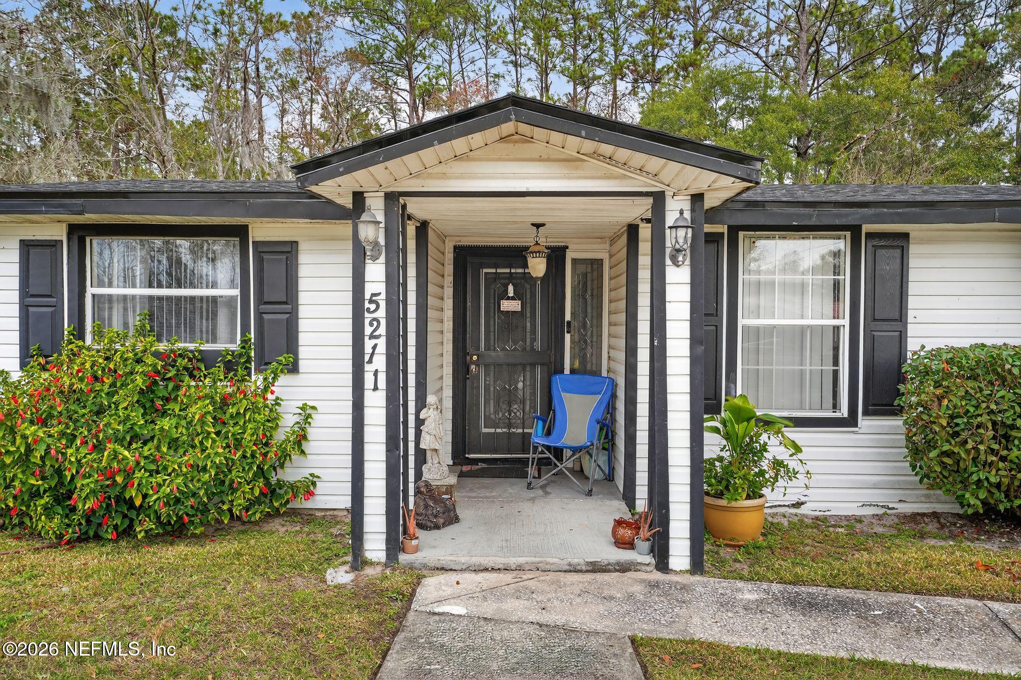 5211 Arrowsmith Road Jacksonville, FL 32208 - Photo 2 of 24 a view of a house with patio