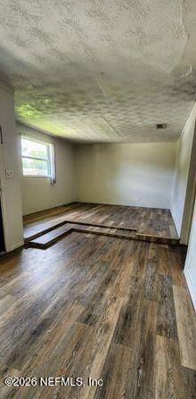 5211 Arrowsmith Road Jacksonville, FL 32208 - Photo 4 of 24 a view of a room with wooden floor