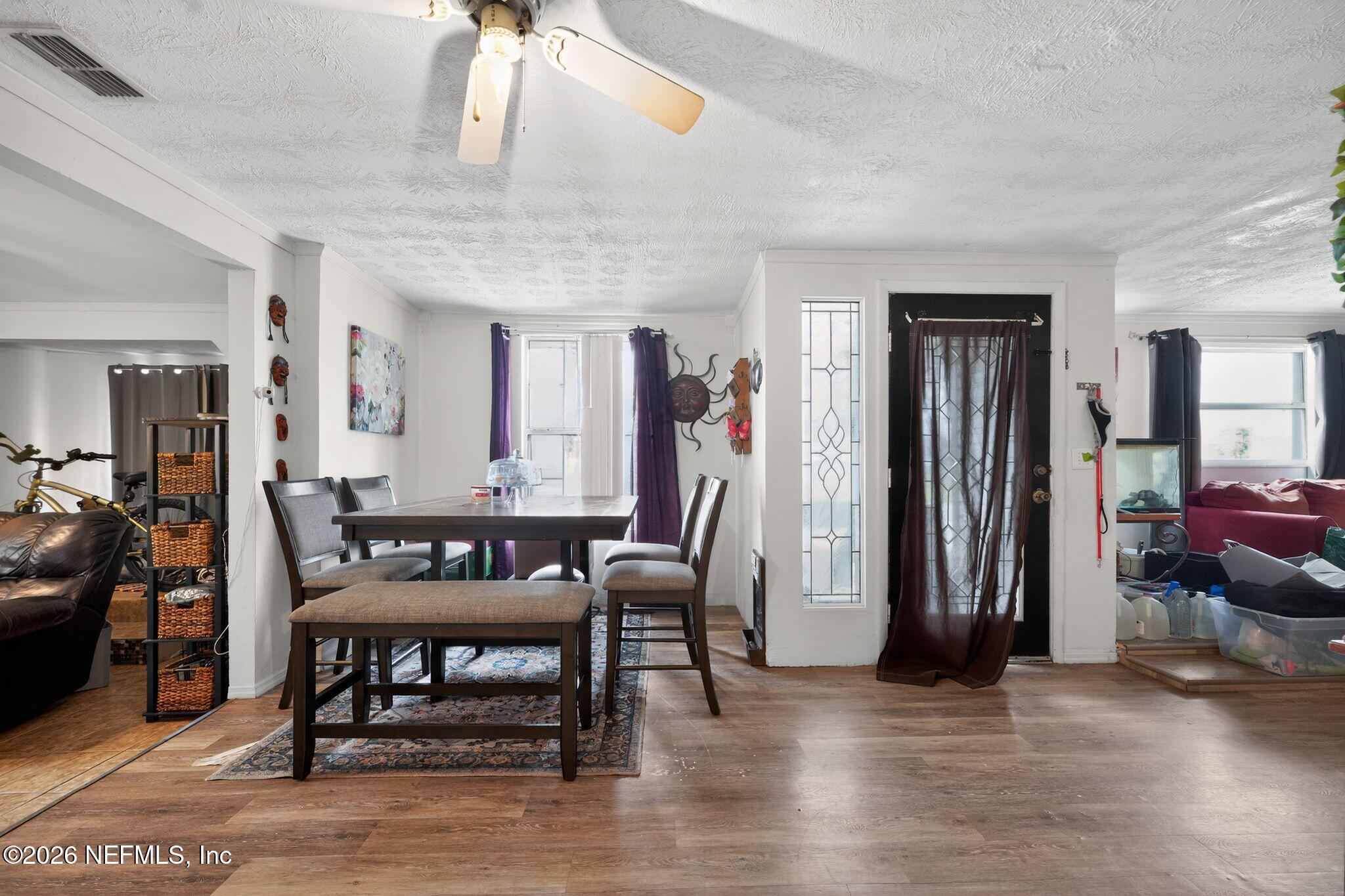 5211 Arrowsmith Road Jacksonville, FL 32208 - Photo 6 of 24 a view of a livingroom with furniture and front door