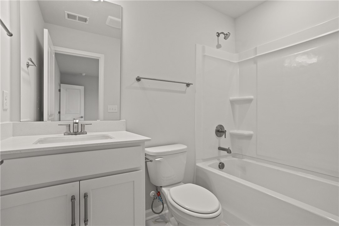 631 Sweetspire Trail, Unit 148 Seneca, SC 29678 - Photo 25 of 36 A well-appointed bath features a clean white vanity and a practical shower-tub combination.