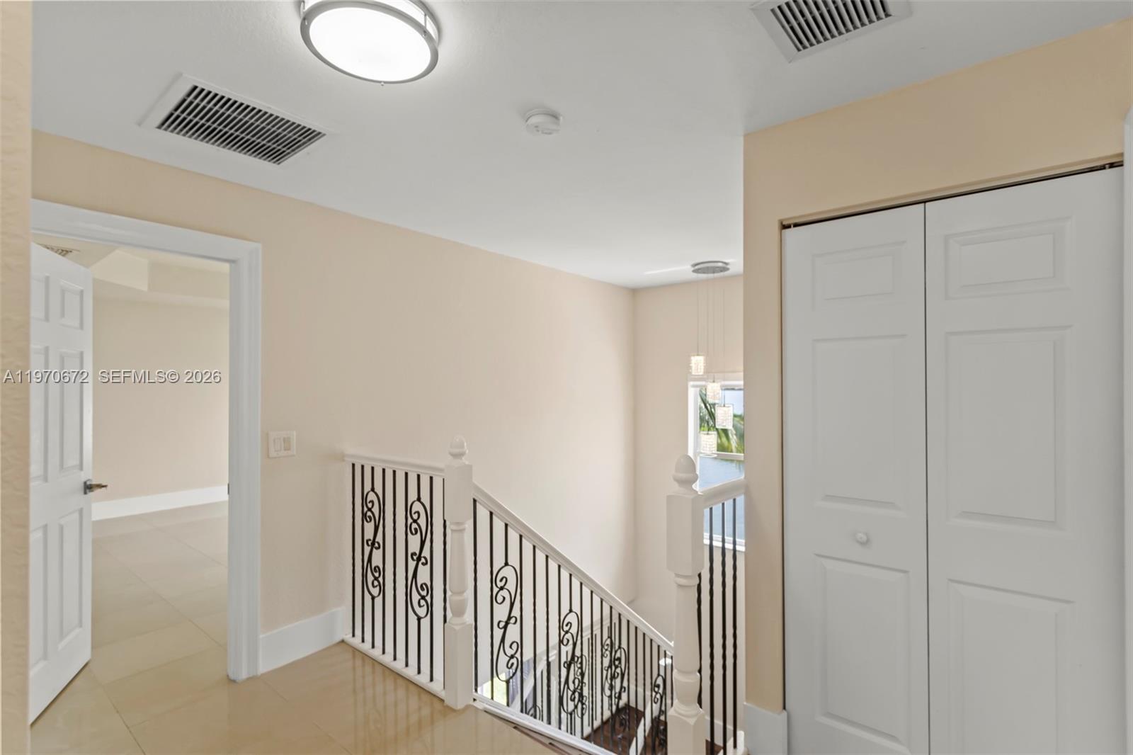 4116 Southwest 179th Way Miramar, FL 33029 - Photo 15 of 43 a view of a hallway with wooden floor and entryway