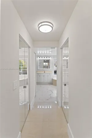 a bathroom with a glass door shower