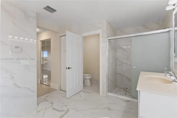 a bathroom with a sink and toilet
