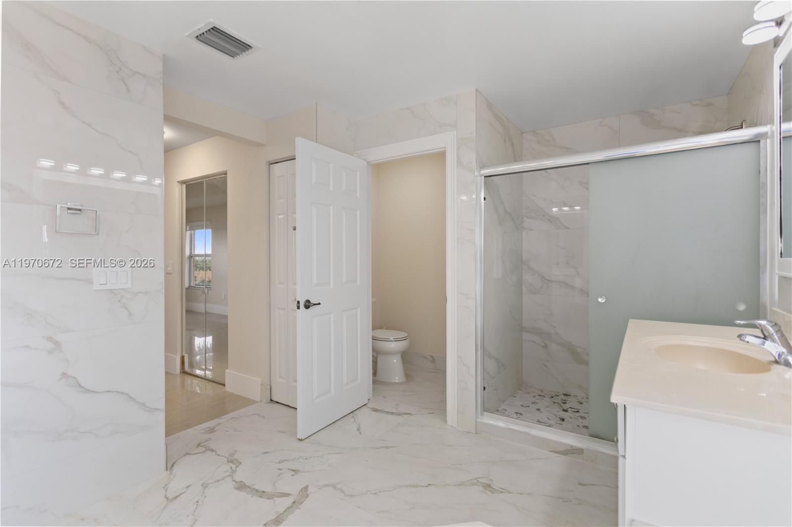 4116 Southwest 179th Way Miramar, FL 33029 - Photo 22 of 43 a bathroom with a sink and toilet