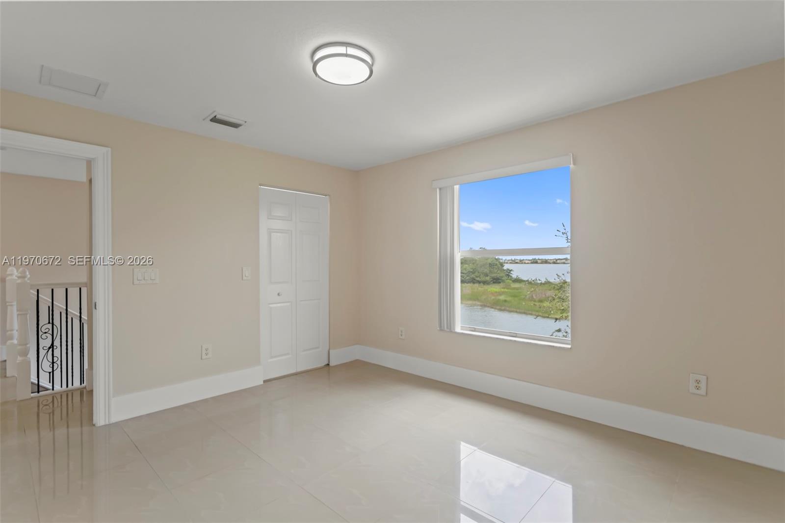 4116 Southwest 179th Way Miramar, FL 33029 - Photo 26 of 43 an empty room with a window