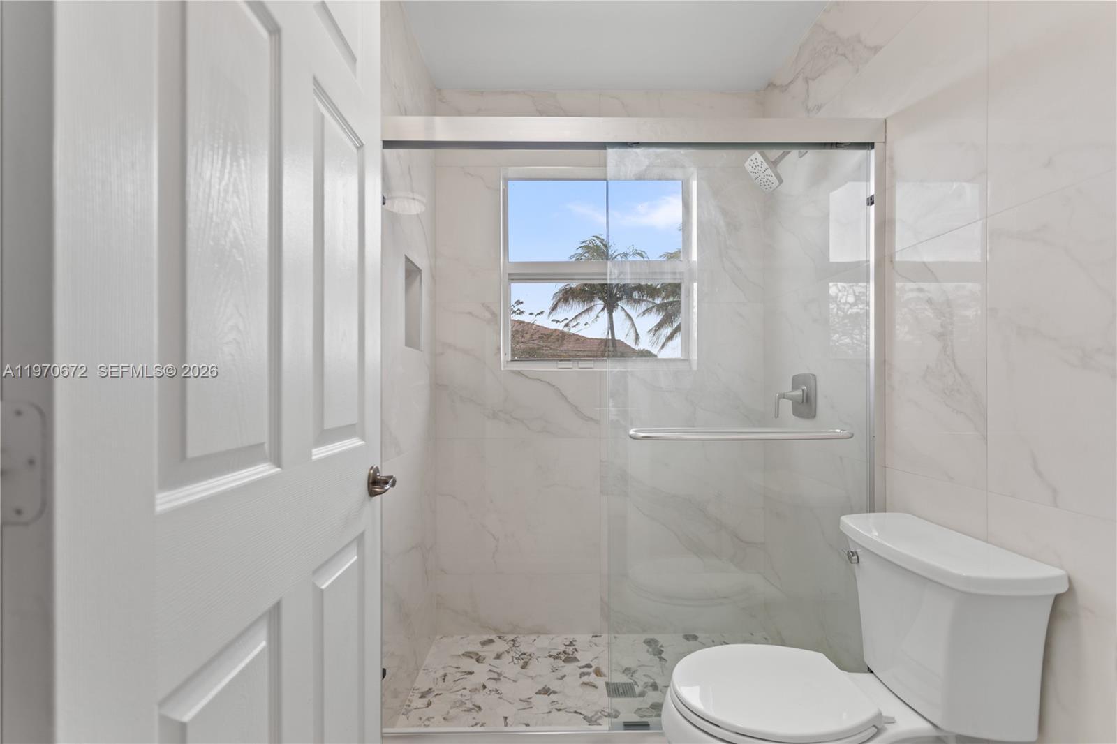 4116 Southwest 179th Way Miramar, FL 33029 - Photo 29 of 43 a white toilet sitting next to a bathroom sink