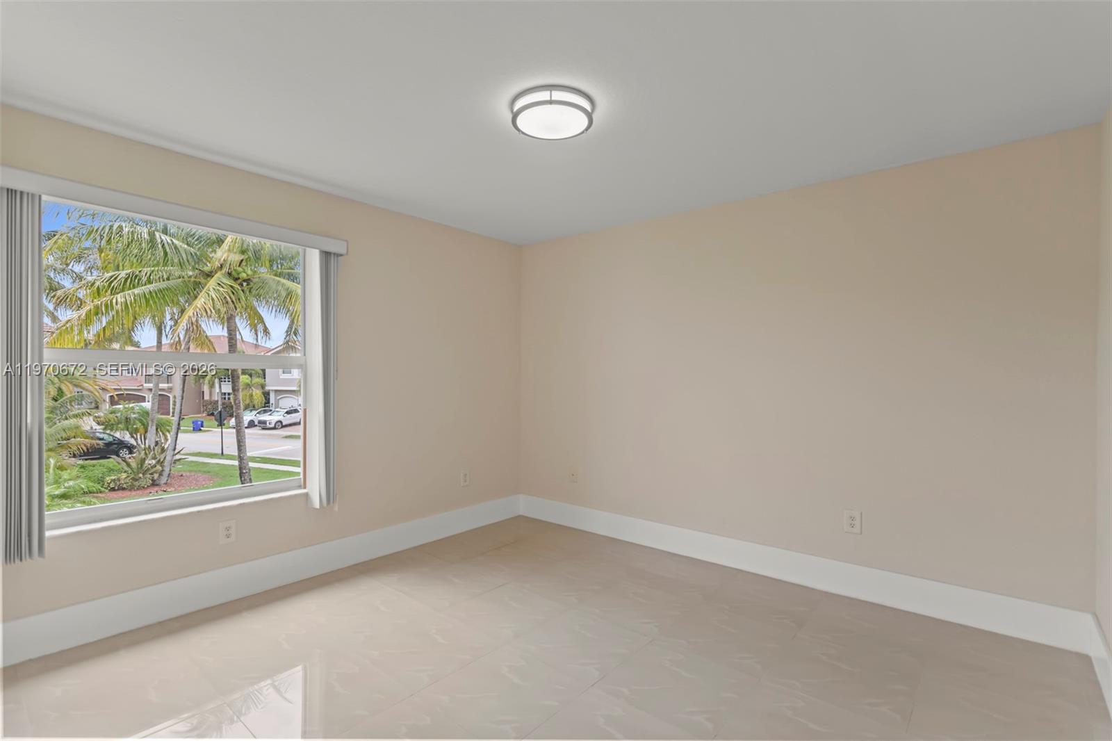 4116 Southwest 179th Way Miramar, FL 33029 - Photo 33 of 43 an empty room with a window