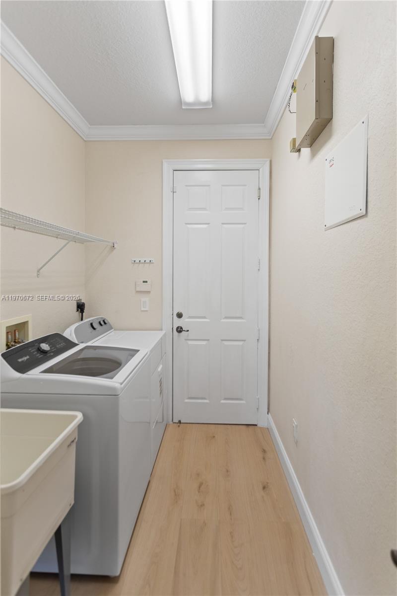 4116 Southwest 179th Way Miramar, FL 33029 - Photo 36 of 43 a view of a kitchen that has a sink and refrigerator