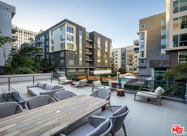 a room with pool table and windows
