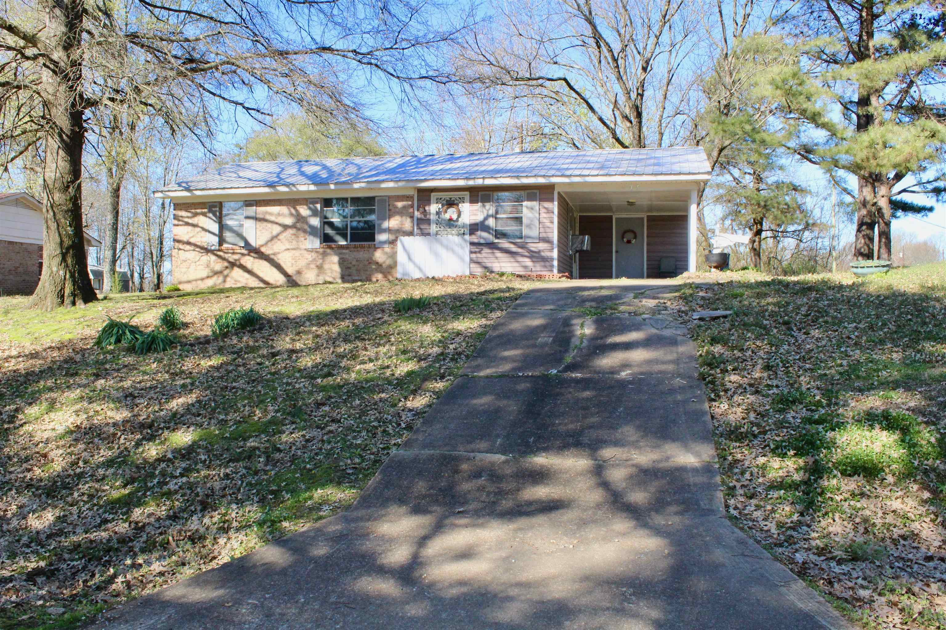 135 Ross Road Ripley, TN 38063 - Photo 1 of 18 a front view of a house with garden