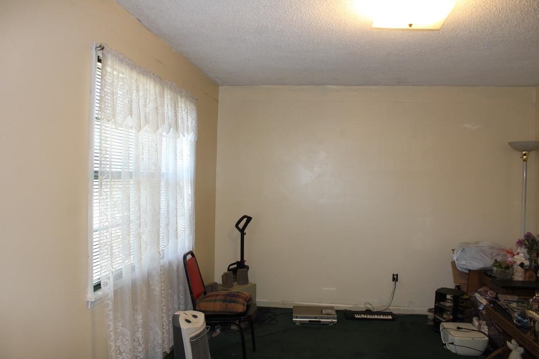 135 Ross Road Ripley, TN 38063 - Photo 13 of 18 a room with furniture and a window