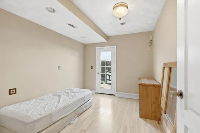 a bathroom with a sink toilet and a mirror