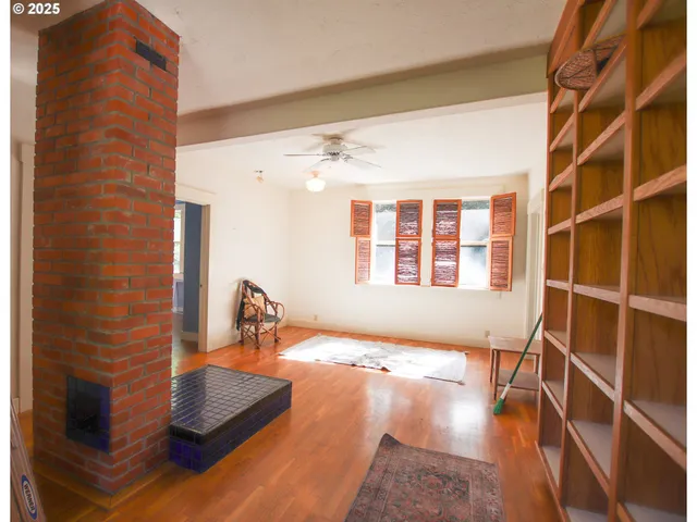 a view of a room with gym equipment and windows