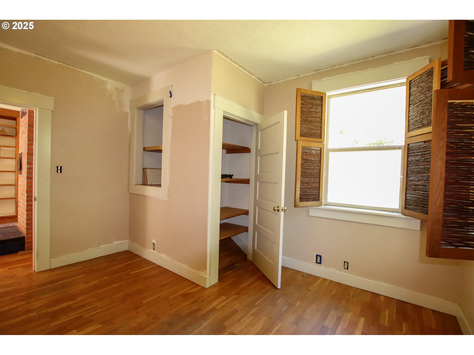 92976 Deadwood Creek Road Deadwood, OR 97430 - Photo 29 of 46 a view of an empty room with wooden floor and a window