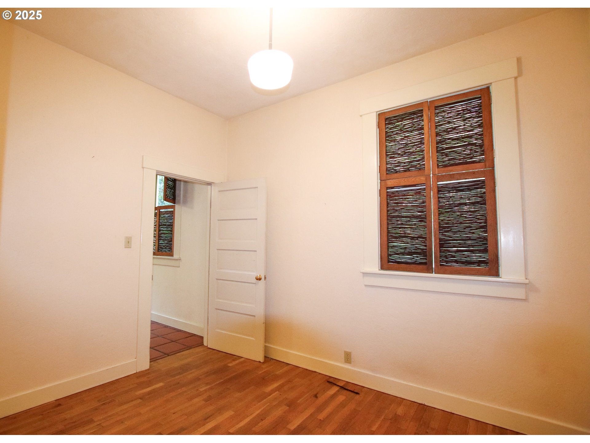 92976 Deadwood Creek Road Deadwood, OR 97430 - Photo 31 of 46 a view of an empty room with wooden floor and a window