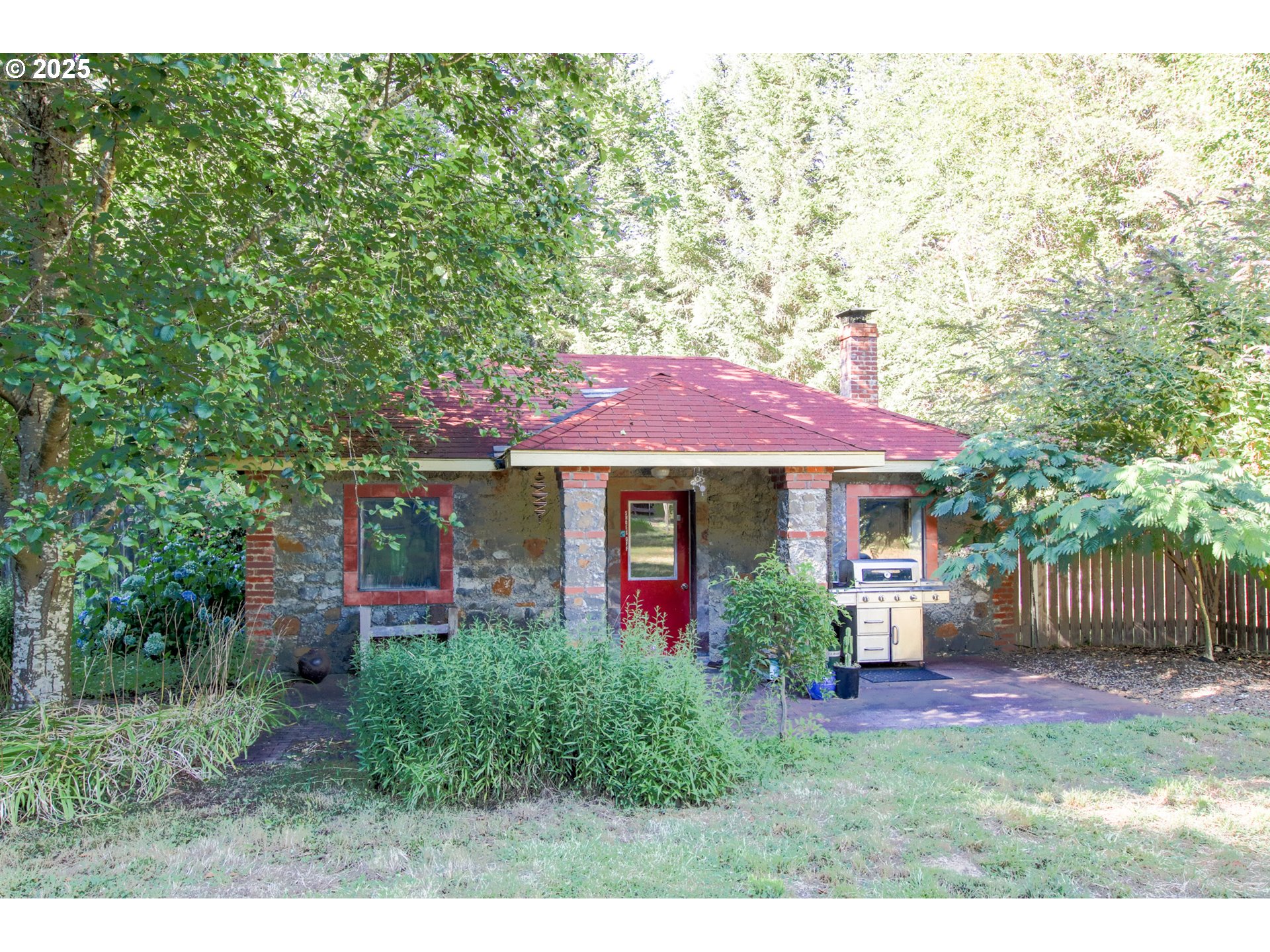 92976 Deadwood Creek Road Deadwood, OR 97430 - Photo 37 of 46 a view of a house with a yard potted plants and a large tree
