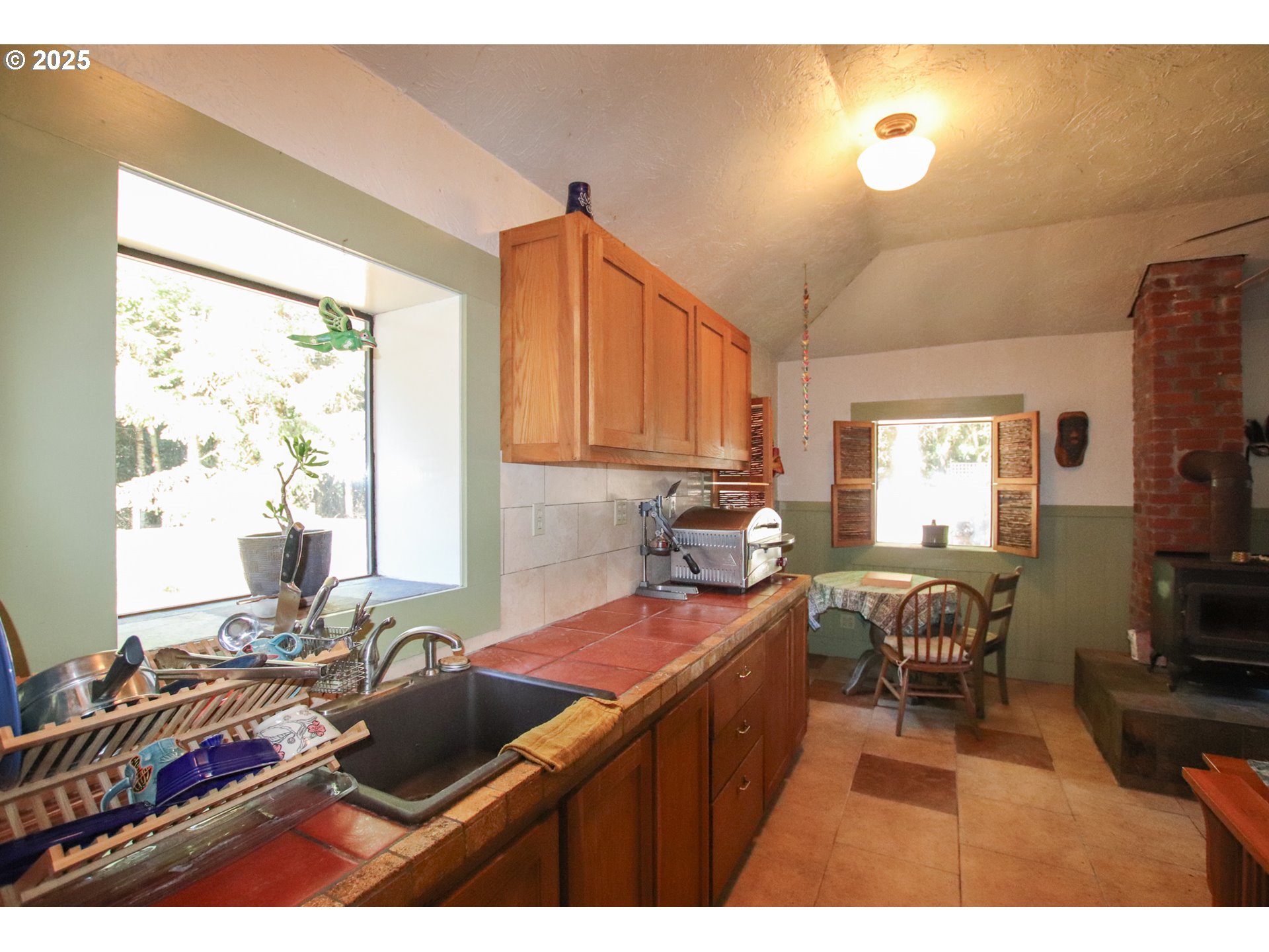 92976 Deadwood Creek Road Deadwood, OR 97430 - Photo 40 of 46 a kitchen with a refrigerator and a stove top open