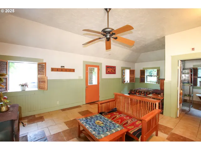 a bedroom with furniture and a window