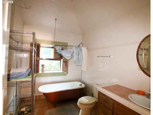 a bedroom with furniture and a chandelier