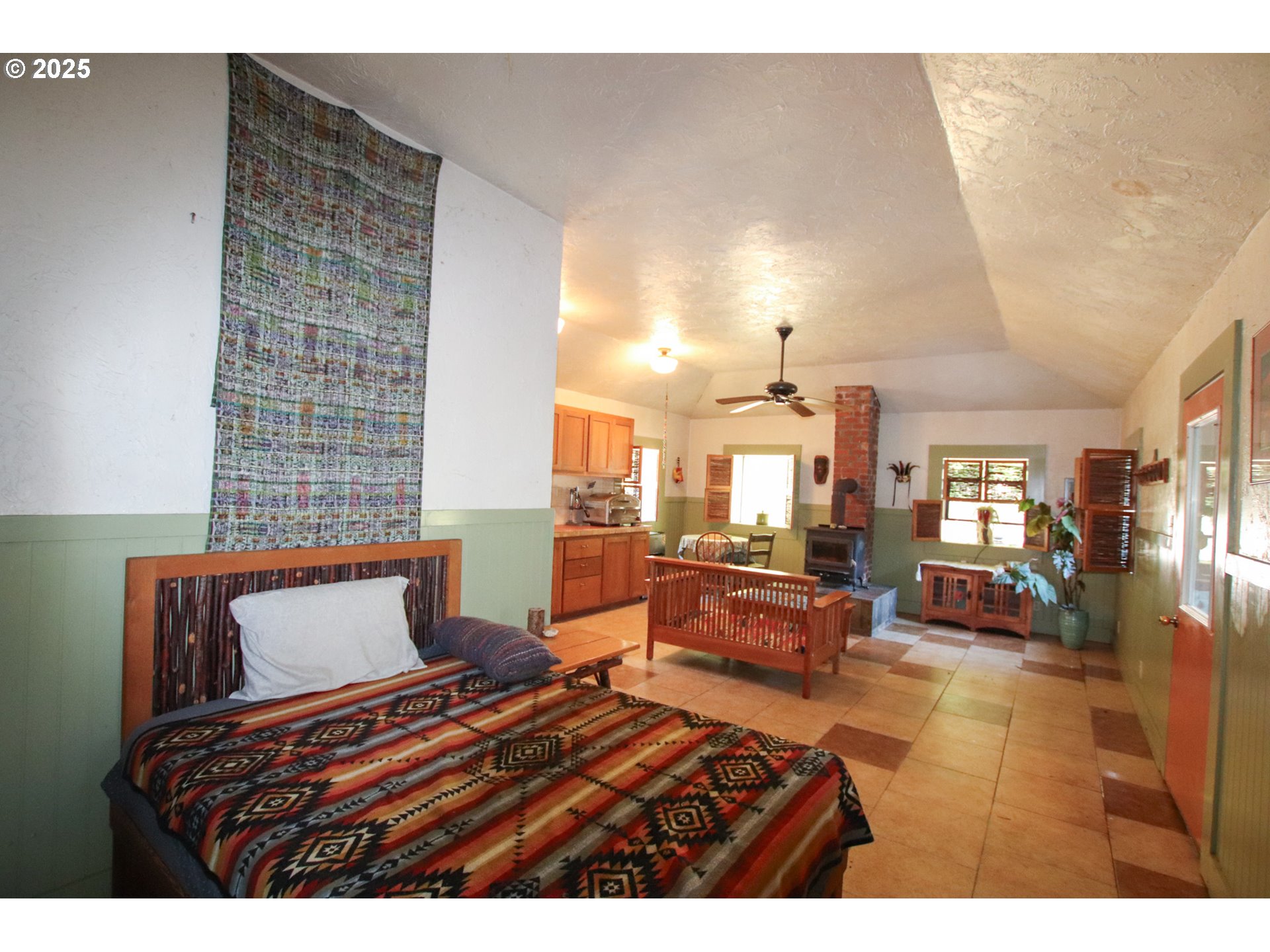 92976 Deadwood Creek Road Deadwood, OR 97430 - Photo 44 of 46 a bedroom with furniture and a chandelier