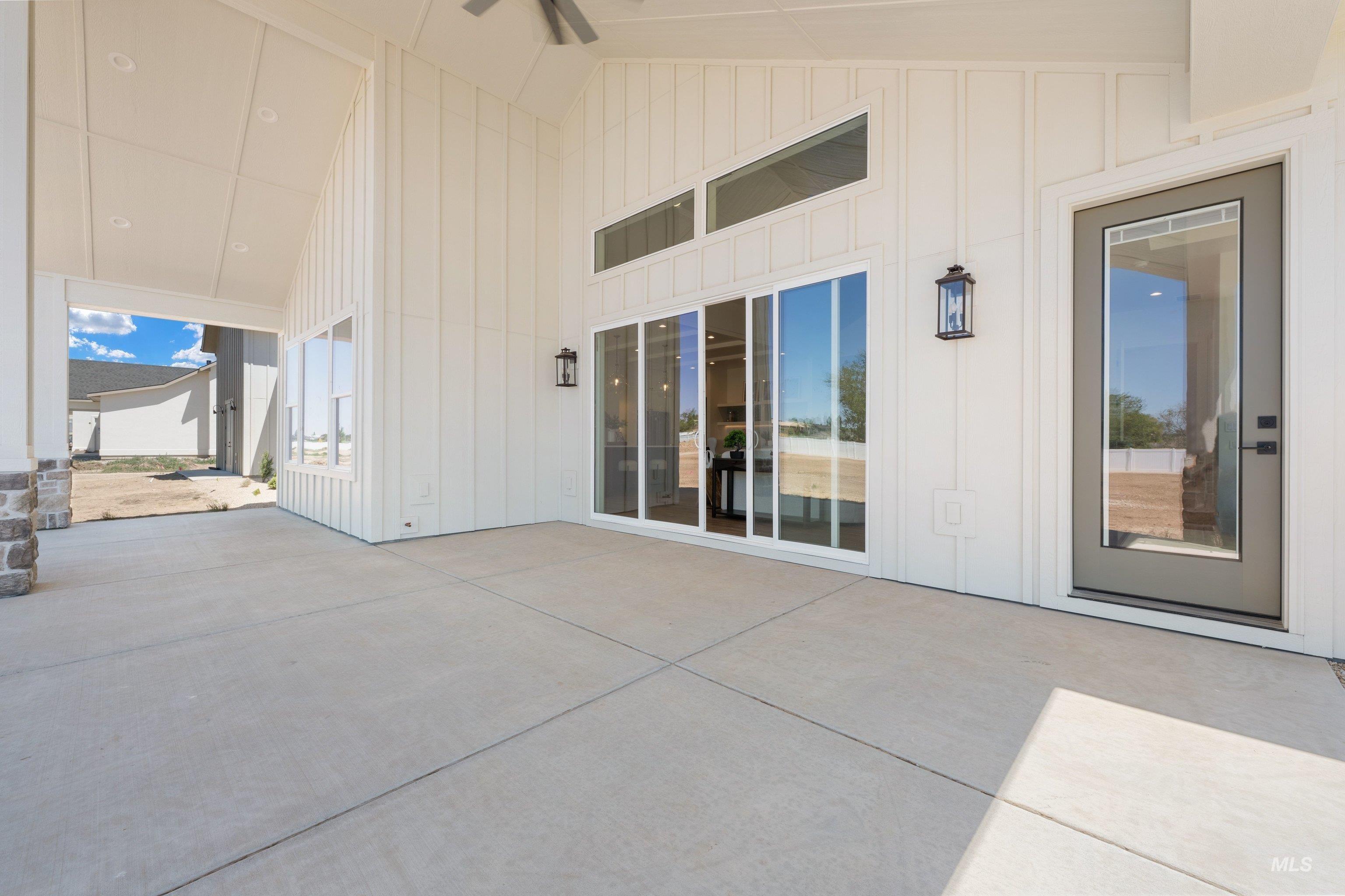 24821 Ardmore Court Caldwell, ID 83607 - Photo 40 of 43 Expansive concrete patio featuring a vaulted ceiling with recessed lighting and a ceiling fan