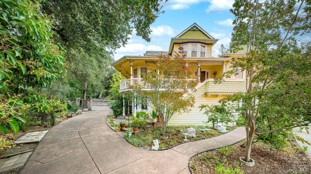 a front view of a house with garden