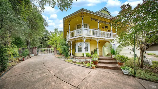 a front view of a residential apartment building with a yard