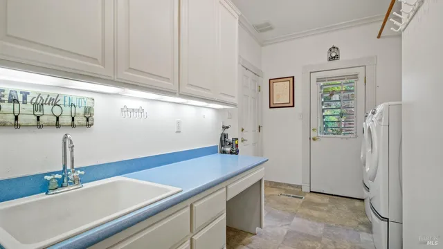 a bedroom with a bed and large window