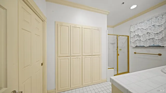 a room with a black white checkered floor and a rug