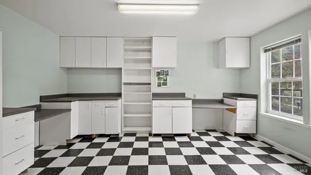 a bathroom with a sink mirror and toilet